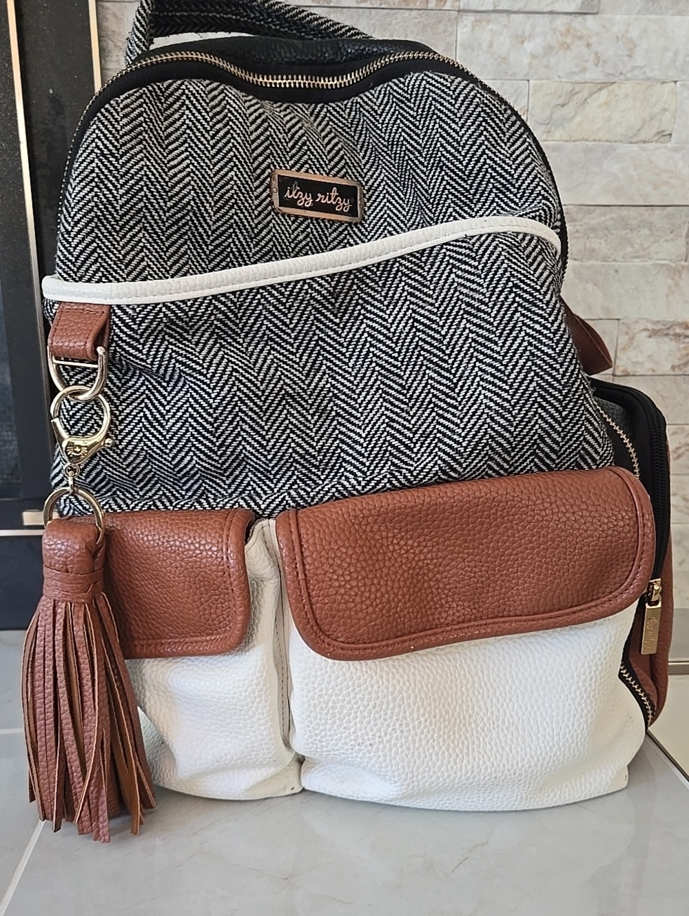 Itzy Ritzy Black, White & Brown Convertible Backpack/Diaper Bag with Tassel